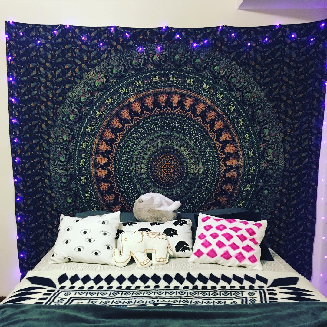 I currently love my bed! And my hamsa lights #boho #tapestry
